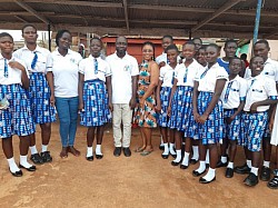 Mad. Bernice and learners in a pose after a sensitization program at Bepong
